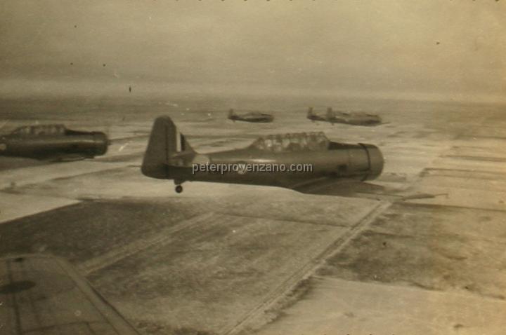 Peter Provenzano Photo Album Image_copy_132.jpg - Royal Canadian Air Force (RCAF), North American Harvard IIB (AT-6A) trainers in fligh over Saskatchewan Canada, 1942.